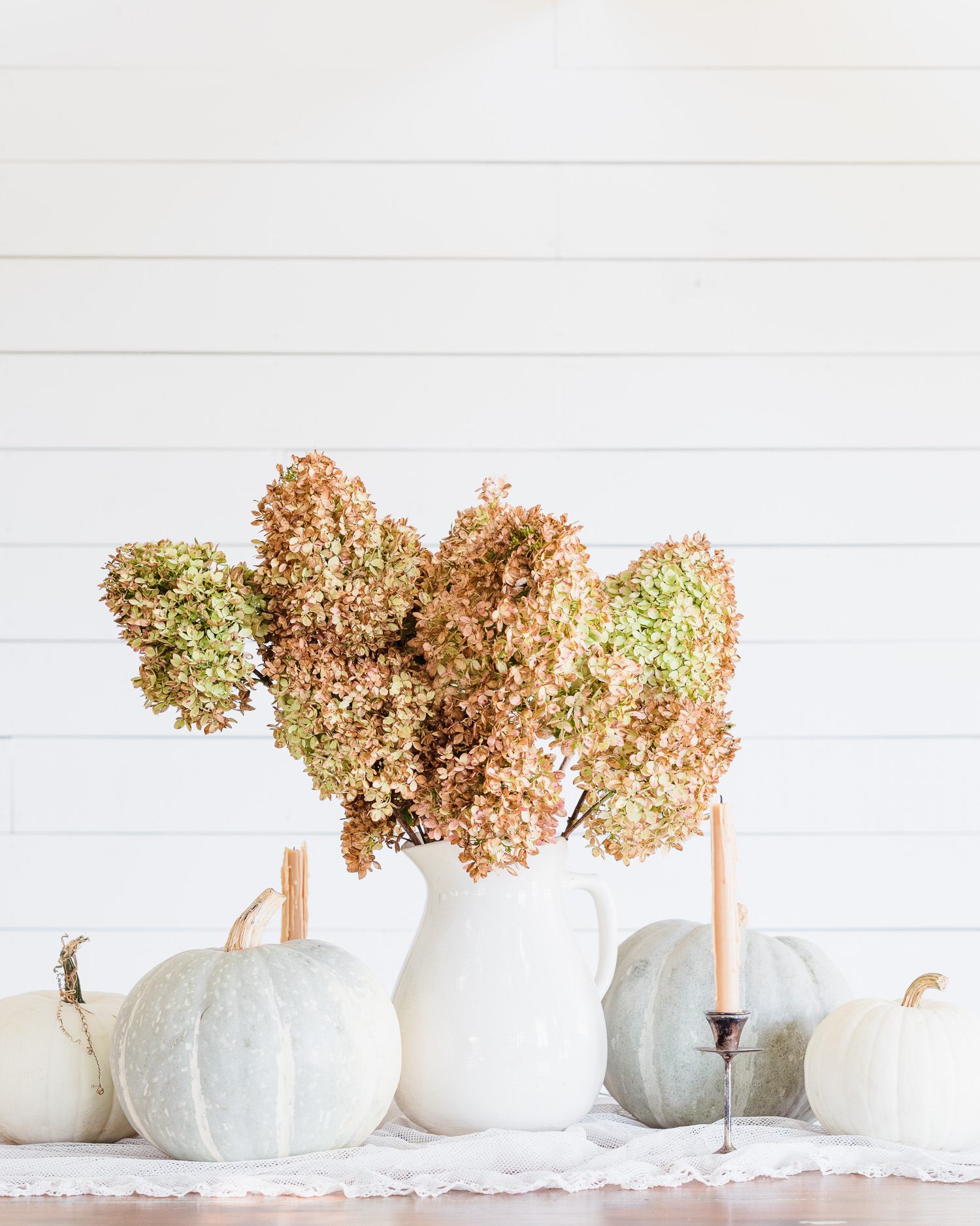 Dried Hydrangeas in an antique ironstone vase with pumpkins & candles