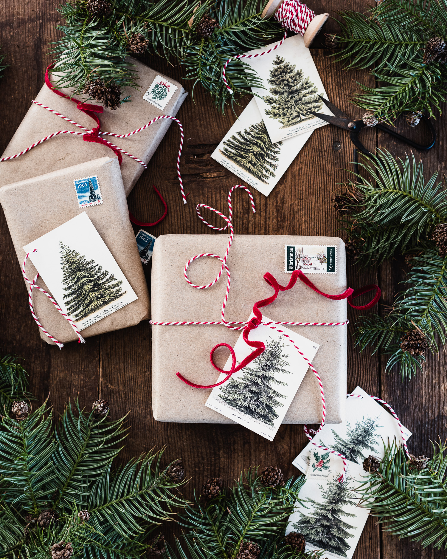 Christmas gifts wrapped in brown paper, vintage stamps, bakers twine