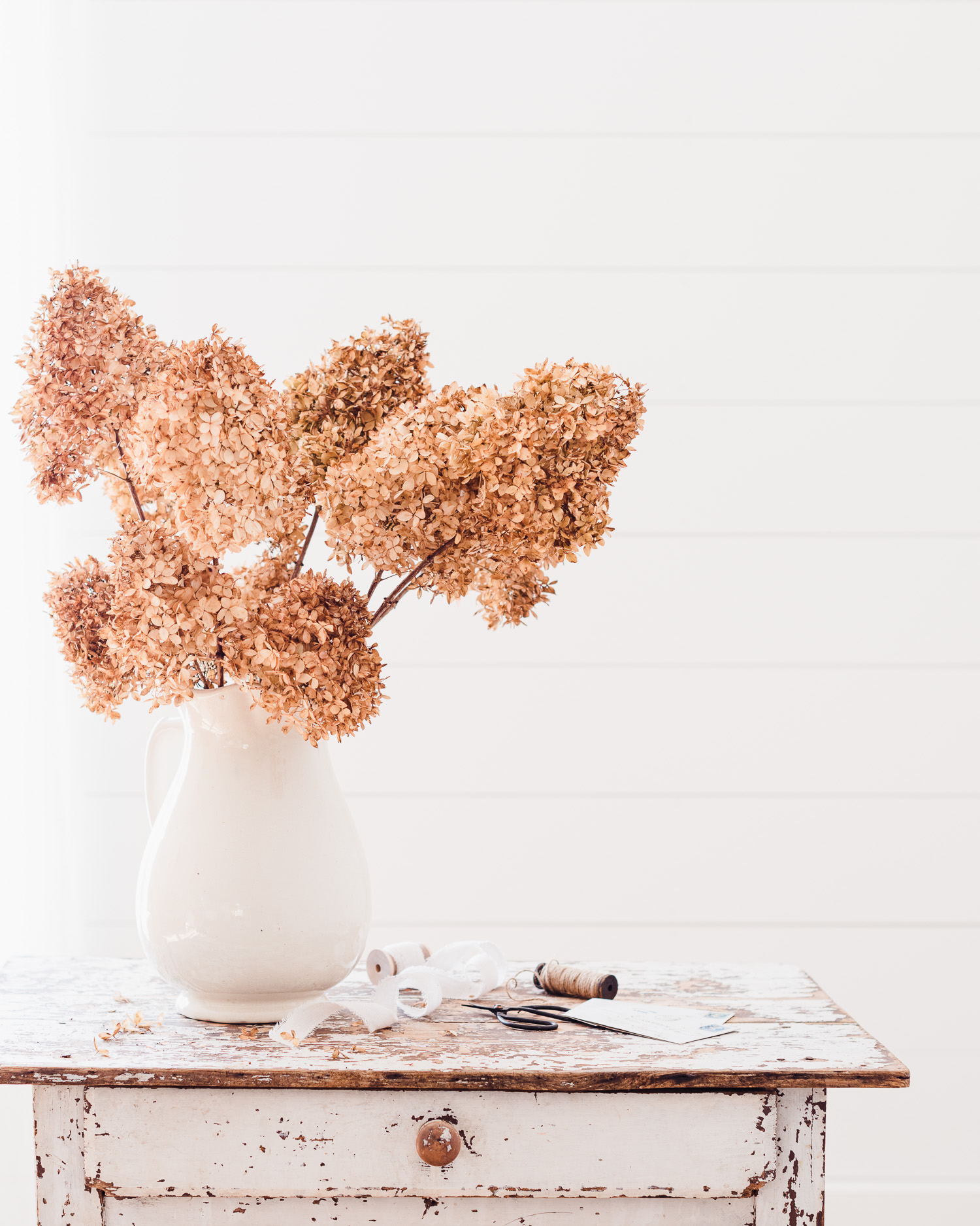 Dried Hydrangeas in an ironstone vase, French letters