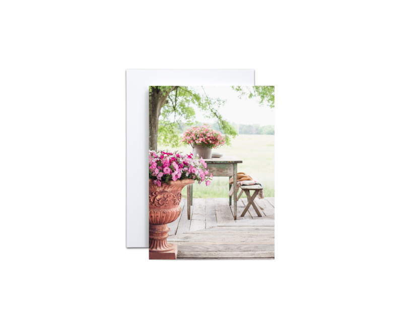 Southern Spring Greeting Card. Flowers on a old porch, vintage watering can