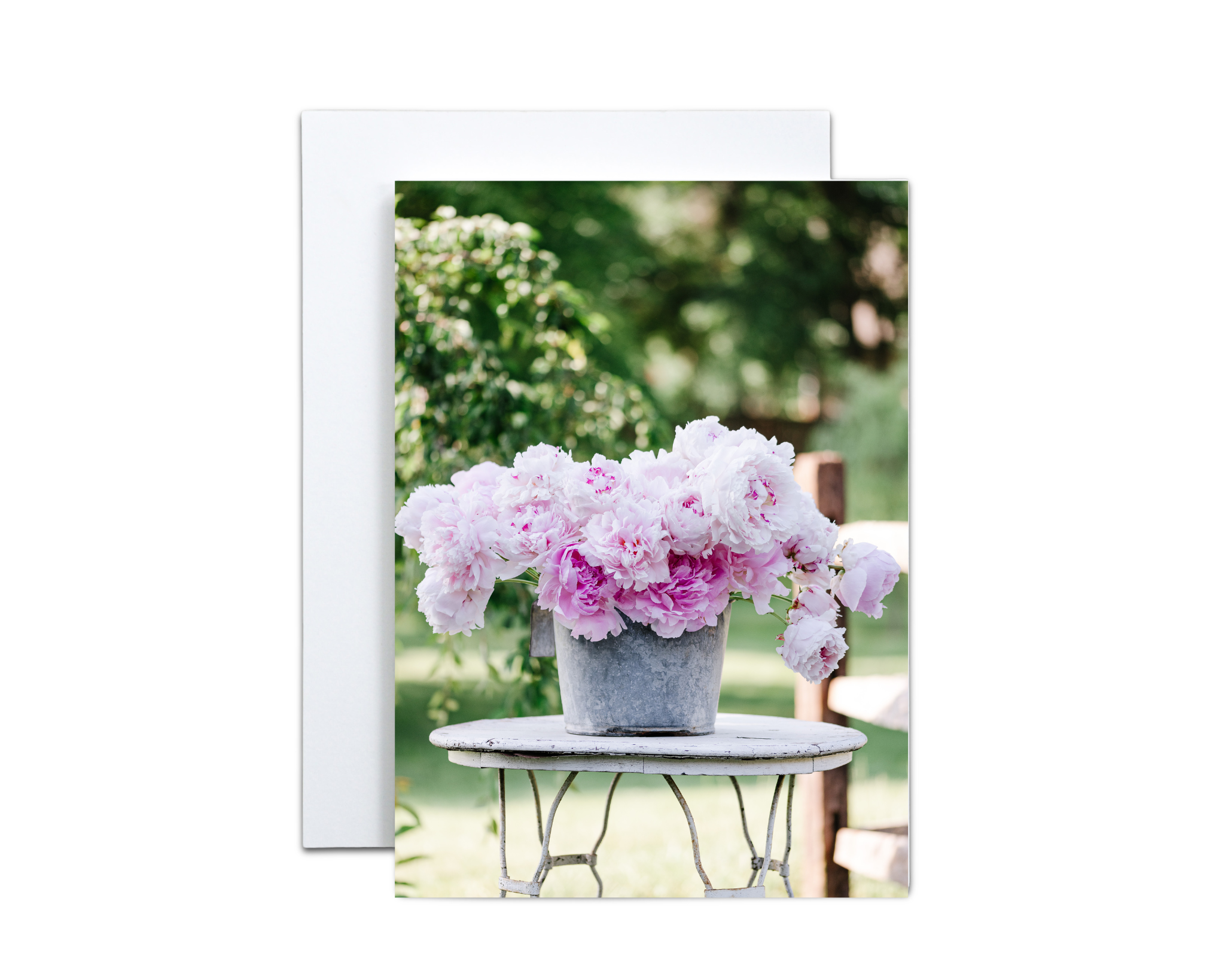 Greeting Card/Notecard. A vintage calf bucket filled with fluffy peonies. The peonies are grown, harvested, and photographed on our farmland.
