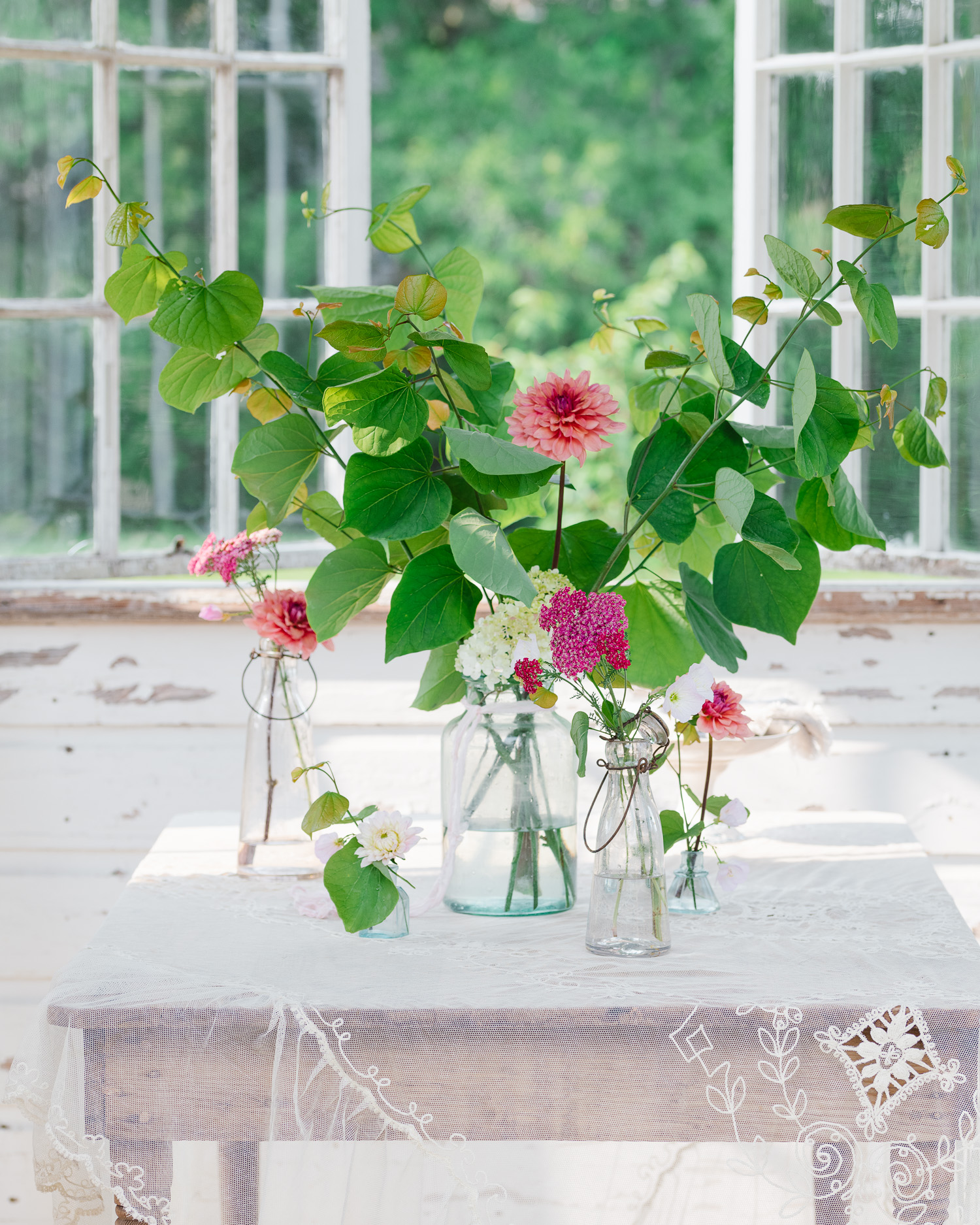 The Flower House. Antique lace, flowers in vintage vases.