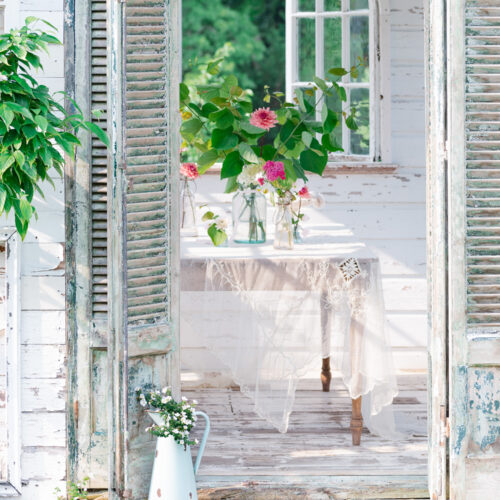 Looking inside of The Flower House. Antique French shutter doors and a bouquet of flowers. Flower Greeting Cards