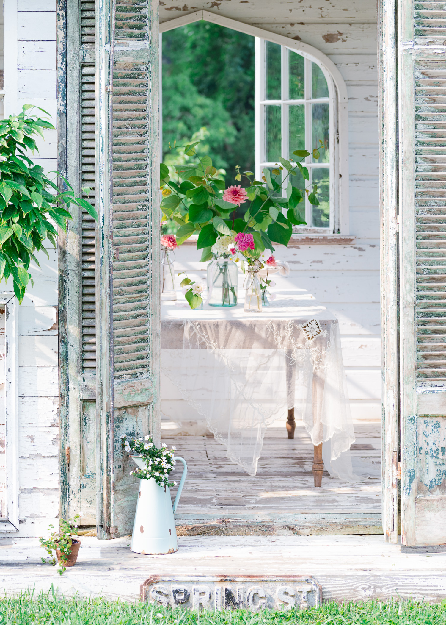 Looking inside of The Flower House. Antique French shutter doors and a bouquet of flowers. Flower Greeting Cards