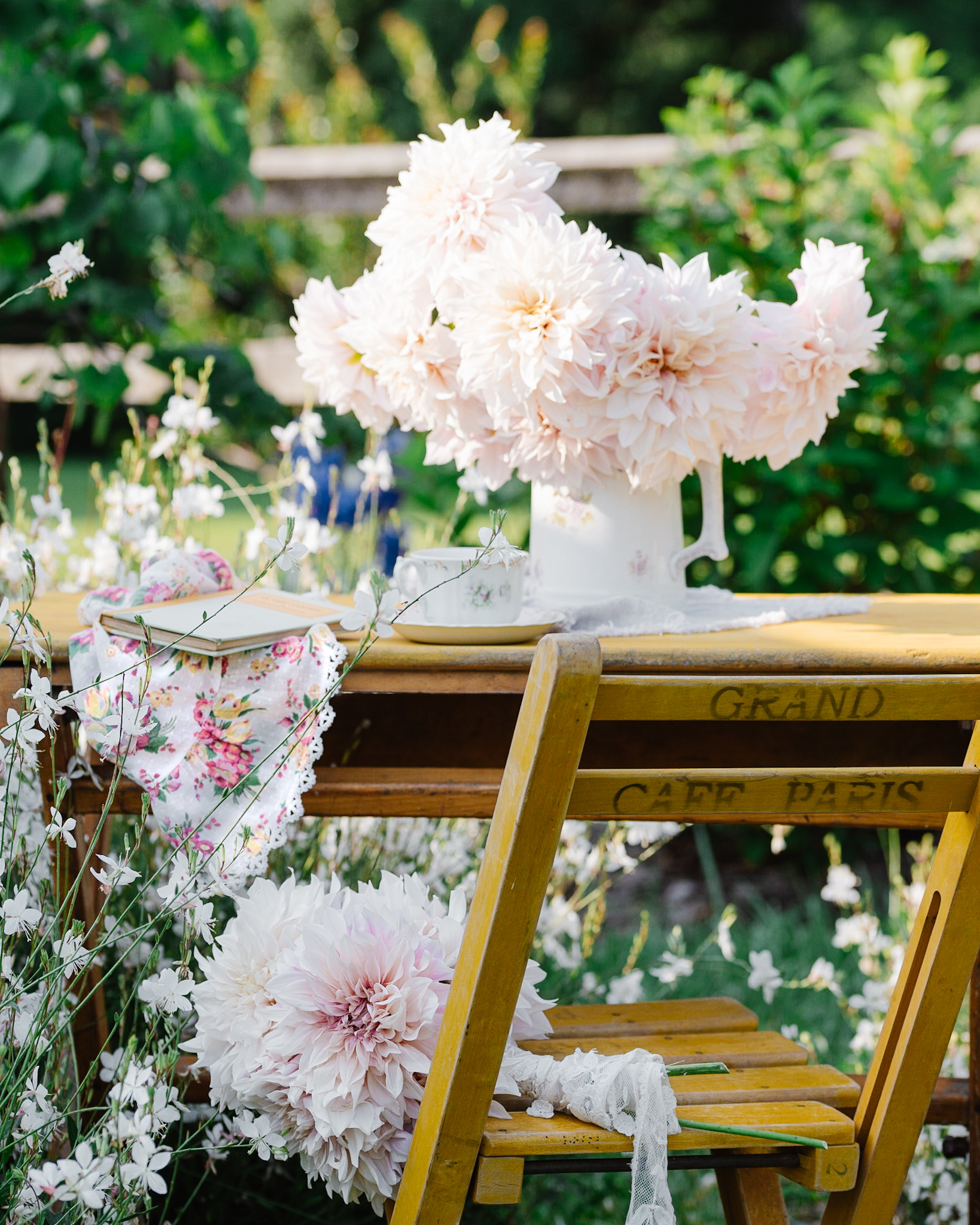 Vintage Café table and dahlias photographed in the flower garden