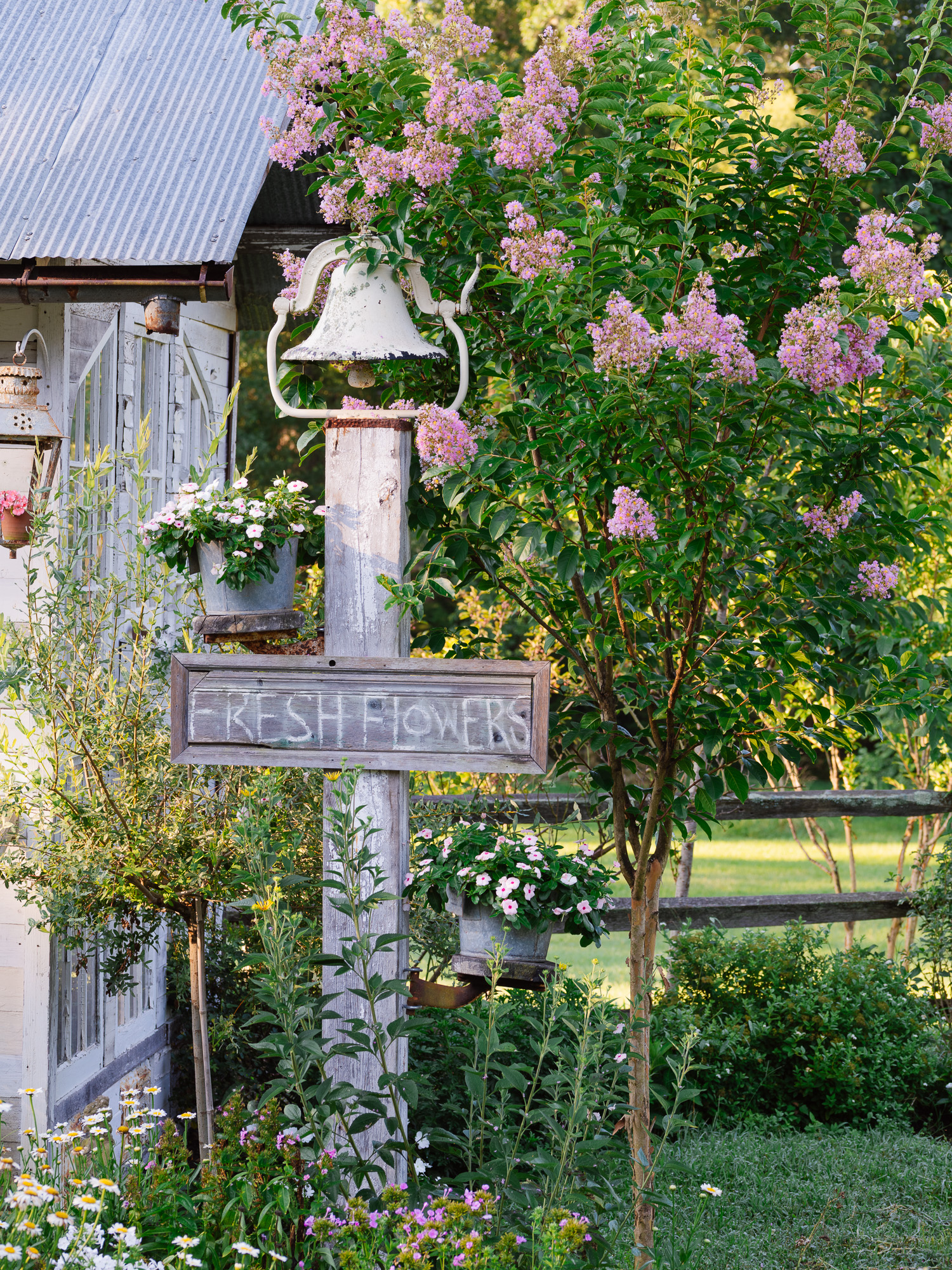 Vintage Bell, Fresh Flowers sign in the flower garden beside the flower house Antique Bell, The Flower House