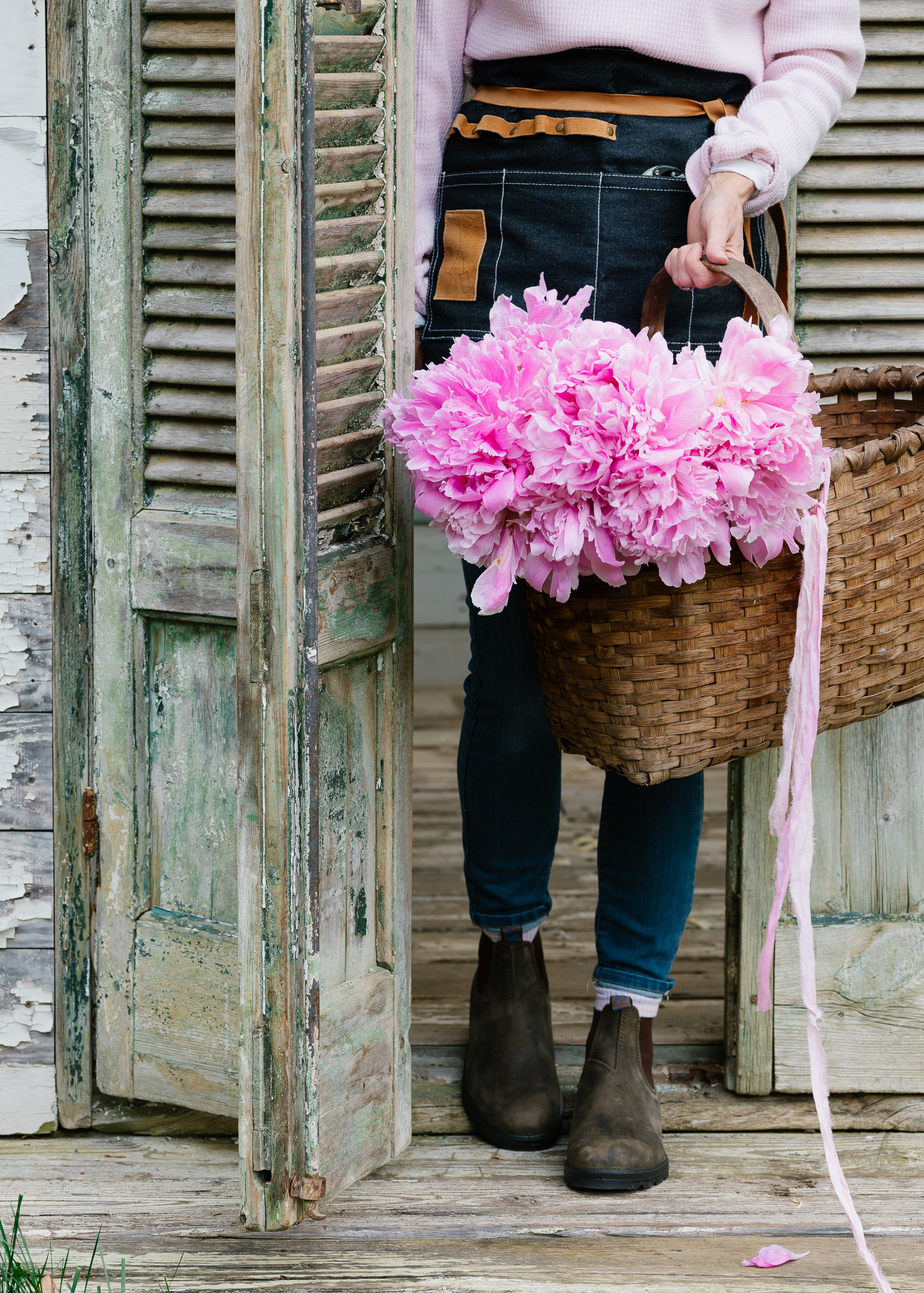 flower gardener with pink peonies